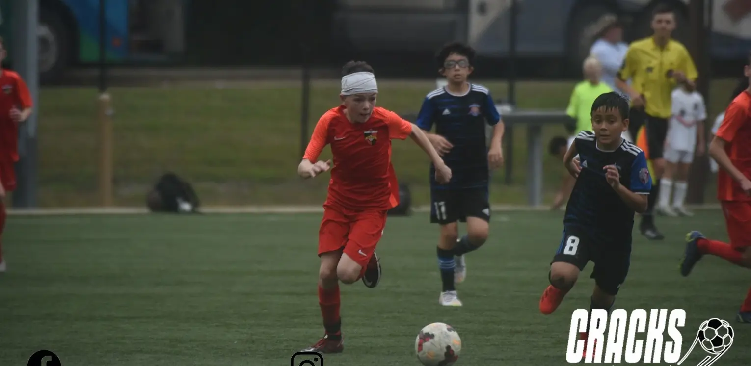 Daylen Hammon in orange Real Colorado kit running with ball at Copa Rayados CF Monterrey tournament November 2022