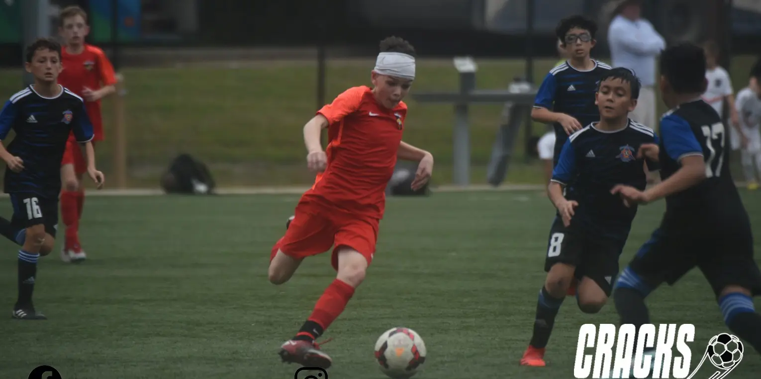 Daylen Hammon in orange Real Colorado kit driving forward at Copa Rayados CF Monterrey tournament November 2022