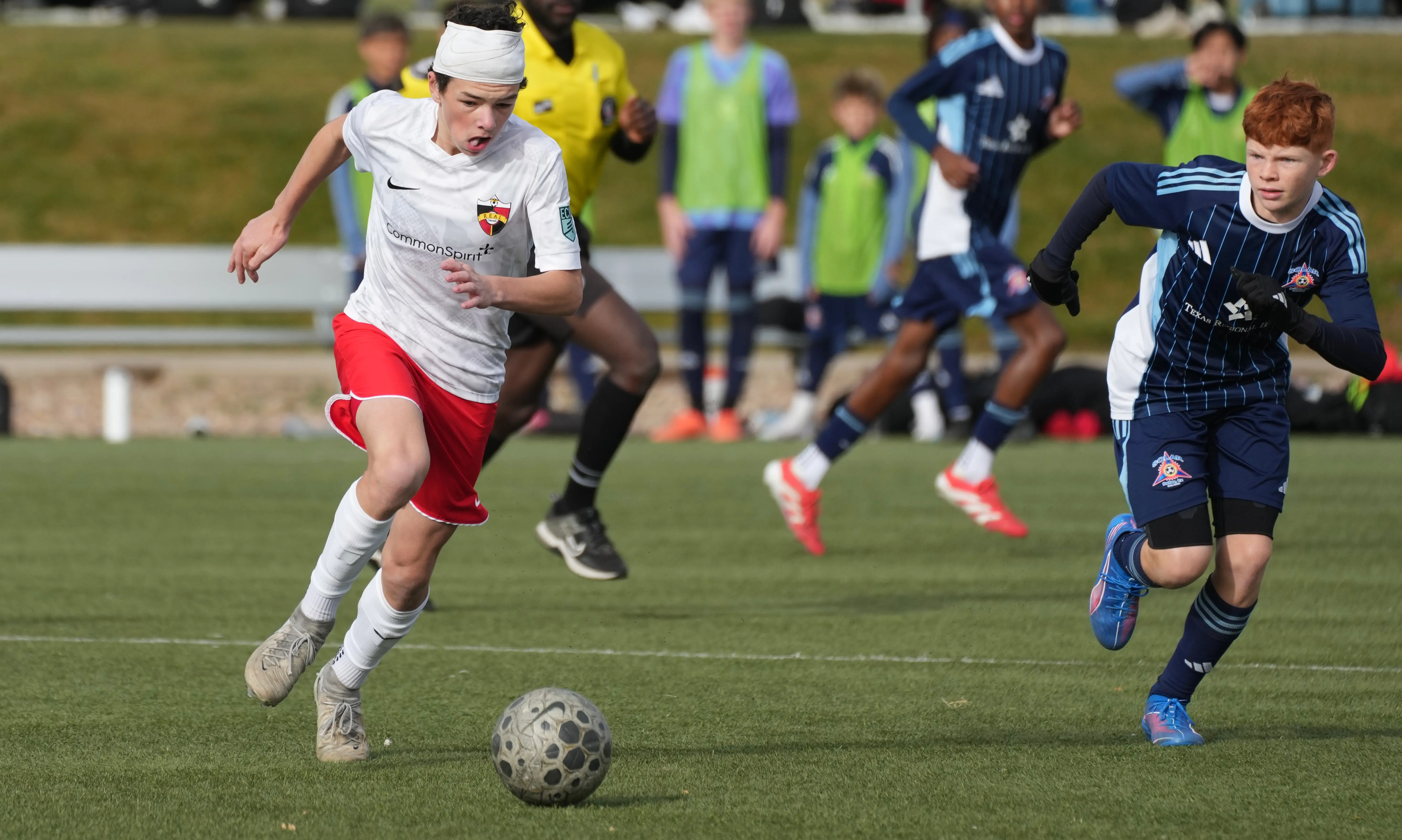 Daylen Hammon in white Real Colorado kit, running with the ball