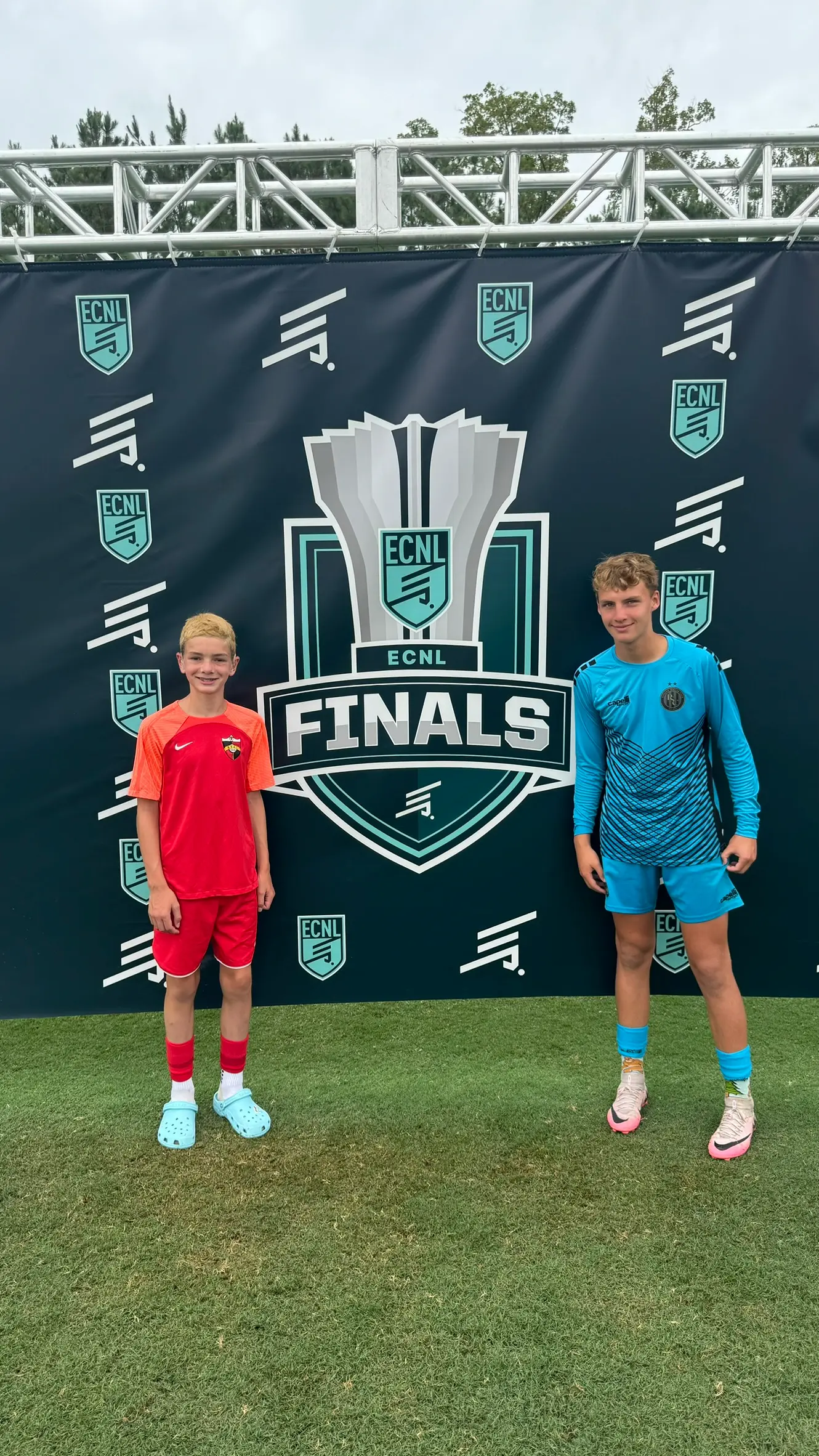 Daylen Hammon with teammate at ECNL Finals step-and-repeat backdrop Virginia Beach 2024
