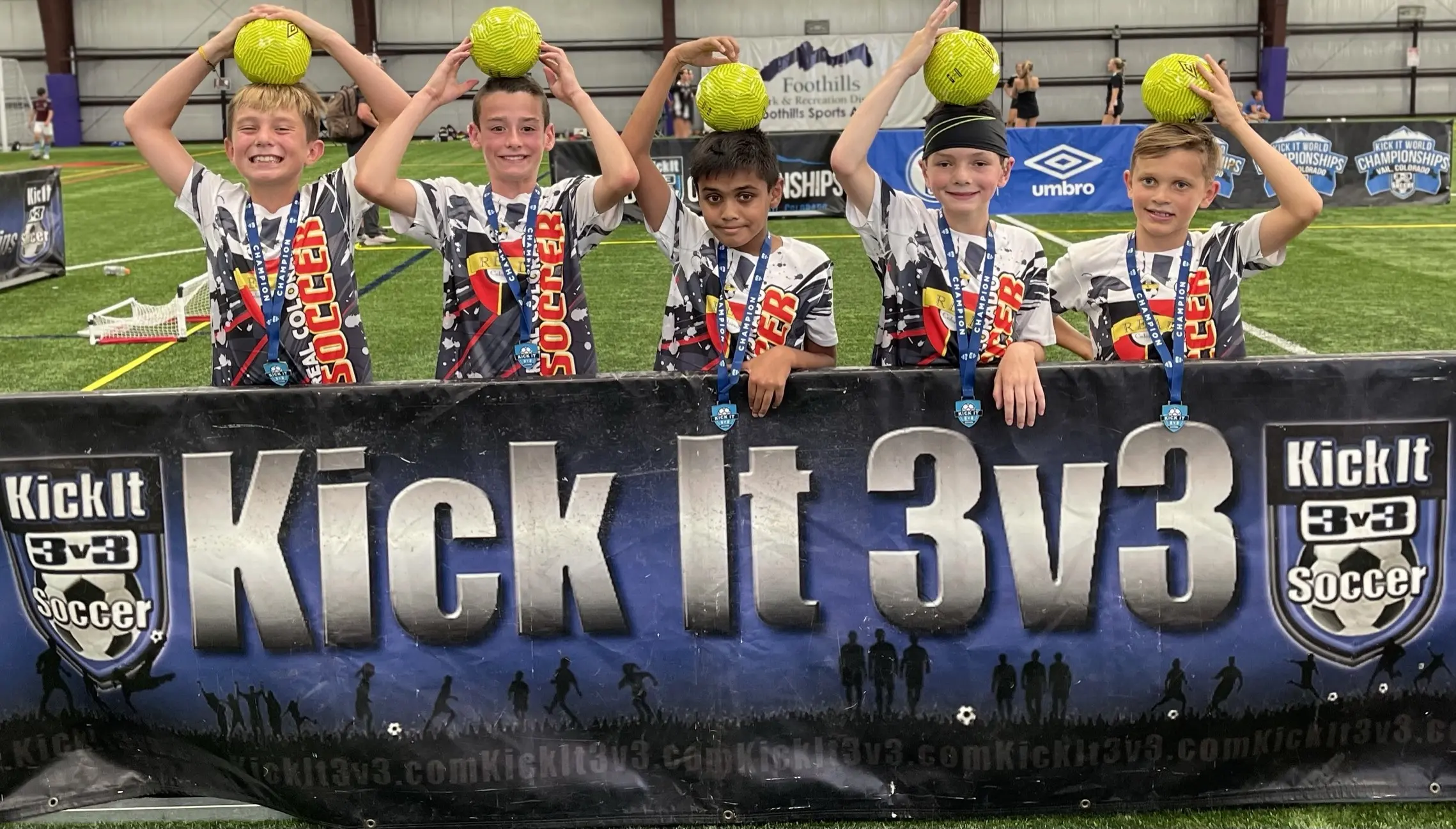 Real Colorado Academy team photo with gold medals and trophy at Las Vegas Mayor's Cup Champions banner