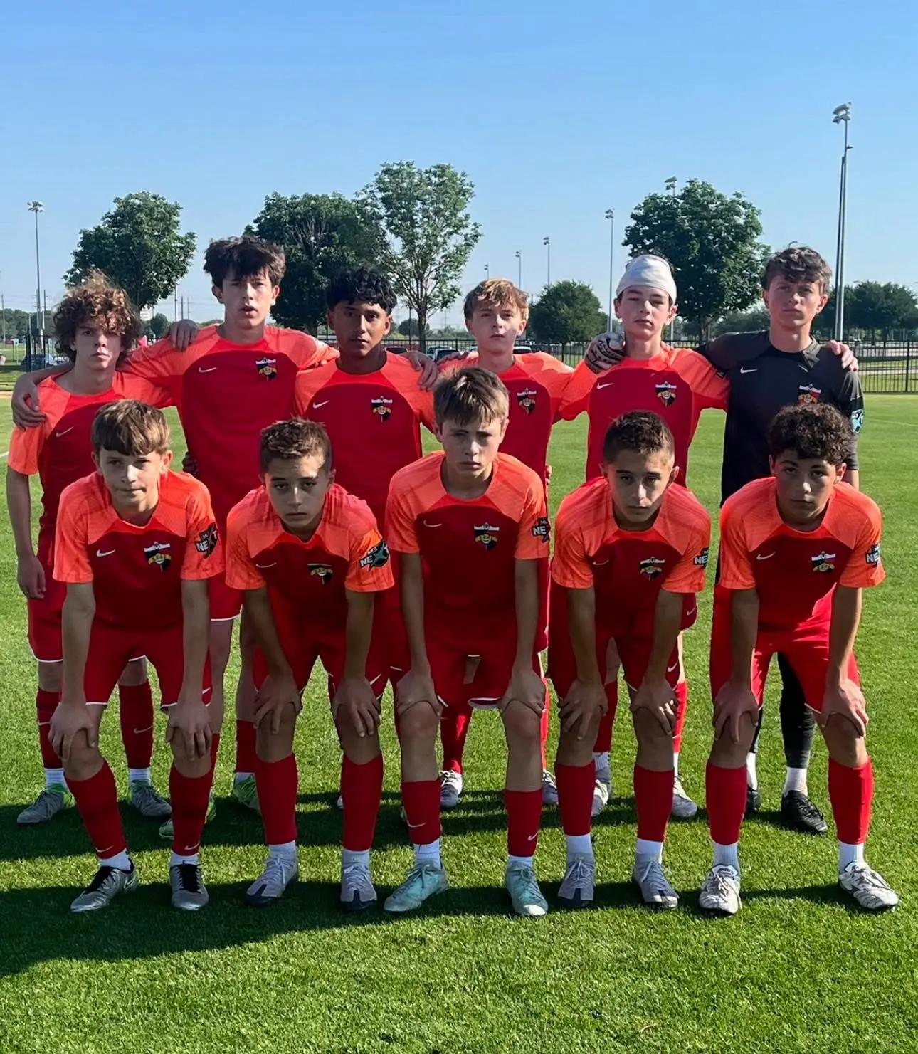 Real Colorado Academy 2011B team photo in red MLS Next kits on field